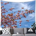 Tapisserie murale de cerisiers en fleurs rose au-dessus d'un canapé gris - 100x70(Peau de Pêche) / Branche de Sakura Rose sur Ciel Bleu