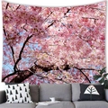 Tenture murale cerisiers en fleurs roses et ciel bleu au-dessus d'un canapé gris - 100x70(Peau de Pêche) / Grappes de Sakura Roses Denses
