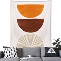 Detail of Nordic geometric wall tapestry hanging over a sofa in a modern cozy room - Boho Geometric Balance Style