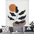 Close-up of minimalist botanical tapestry featuring orange sun and black leaves on a white wall - 100x70(Peach Skin) / Orange Sun and Black Broadleaf (13)