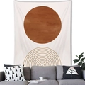 Detail of Nordic geometric wall tapestry hanging over a grey sofa in a modern living room - Sun & Concentric Semicircle Style