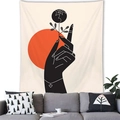Artistic wall tapestry showing a hand holding flowers under a red sun above a sofa - Hand Holding Flower Orange Sun (9)