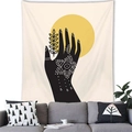 Detail of bohemian tapestry with black hand line art and yellow sun over a gray sofa - Hand Line Art Sun (8)