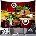Detailed view of an African tribal art tapestry hanging above a modern living room sofa - 100X70 / Tribal Thatch Hut and Canoe (Style 13)