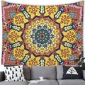 Vibrant mandala wall tapestry hanging above a grey sofa in a modern home interior - Style 7