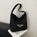 Borsa tote minimalista in tela nera con scritte bianche per il pendolarismo quotidiano - Nero