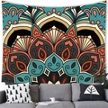 Detail of bohemian mandala tapestry hanging above a grey sofa with decorative pillows - Mandala Style (10)