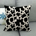 Square linen throw pillow cover featuring a classic black and white cow print pattern - Classic Cow Print / 45x45cm