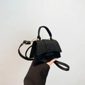 Minimalist black felt crossbody bag with quilted diamond pattern and top handle - Black