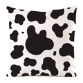 Close-up of black and white cow print pillow cover with faux silk polyester texture - Fun Cow Print