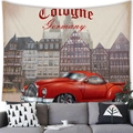 Detail view of Cologne Germany tapestry with vintage red car hanging above a grey sofa - Peach Skin / 230X180 / Cologne Red Car
