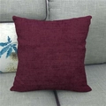 Close-up of wine red linen textured cushion cover on a grey sofa for home decor - 45x45cm / Burgundy