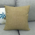 Solid mustard yellow square cushion cover made of coarse linen fabric on a sofa - 45x45cm / Khaki