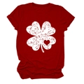 Close-up of vintage distressed four-leaf clover and heart print on red t-shirt - Red (White Text)