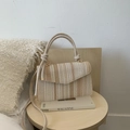 Chic woven straw crossbody bag with colorful striped flap and metallic hardware - Beige