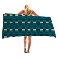 Thick geometric beach towel with blue and beige patterns displayed by a model - Modern Collage Geometric (4)