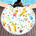 Round tropical cocktail print beach towel with white tassels on pool terrace - Tropical Cocktail Style