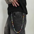 Macro detail of disco ball chain with colorful rhinestones on vintage denim jeans - Multicolor Rhinestone Disco Ball Pant Chain (01974)