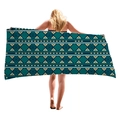 Ethnic geometric beach towel in blue and beige tones held by model on white background - Ethnic Triangle Geometric (5)