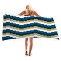 Thick beach towel with blue and yellow geometric wave patterns held by a model - Blue Yellow Zigzag Wave (8)