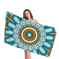 Bohemian mandala beach towel in vibrant blue and orange patterns held by a model - Dark Light Blue Orange Boho Style (9)