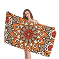 Ethnic Mandala geometric beach towel in orange and brown tones held by a model - Orange Brown Mandala (9)