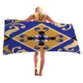 Royal blue beach towel with gold Baroque patterns held by a blonde model - Royal Blue Gold Vintage Baroque (5)