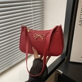 Chic red litchi texture baguette bag featuring a stylish gold bow metal buckle - Red
