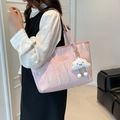 Pink canvas tote bag with wave embroidery and plush cloud charm on a female model - With Pendant / Pink