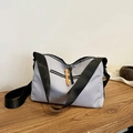 Minimalist grey-purple nylon crossbody bag with black straps and orange zipper accents - Gray