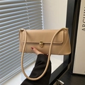 Minimalist beige matte leather underarm baguette bag with elegant gold metal twist lock - Khaki