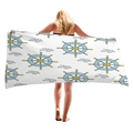 White beach towel with blue ship rudder and fish pattern held by a model from behind - White Rudder Fish (5)