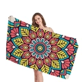 Rectangular beach towel with colorful ethnic mandala pattern held by a model - Colorful All-over Mandala Style (14)