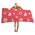Thick red beach towel with nautical patterns like anchors and steering wheels - Red Nautical Theme
