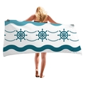 Large sailboat steering wheel and wave pattern beach towel shown on a person - Navy Rudder Waves (10)