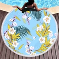 Thick round beach towel with tropical floral pattern and white tassel fringe on wood deck - Fresh Light Blue Floral Style (1)