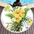Thick round beach towel with tropical floral pattern and white tassel trim on wood floor - Tropical Floral Palm Style (2)