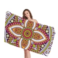 Ethnic mandala geometric patterned microfiber beach towel held by a model - Orange Purple Mandala (13)