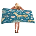 Peacock blue beach towel with cartoon reindeer and floral heart patterns held by a model - Peacock Blue Cartoon Elk Style (1)