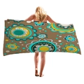 Brown beach towel with mandala patterns held by a model on a white background - Brown Mandala Floral Style (3)
