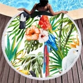 Round tropical beach towel with parrot prints and white tassels on pool deck - Tropical Rainforest Parrot