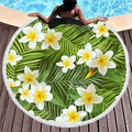 Tropical round beach towel with palm leaf pattern and fringes on pool side - Plumeria Palm Leaves