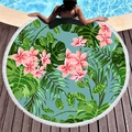 Round tropical beach towel with fringe edge featuring monstera leaves and frangipani print - Pink Plumeria Monstera
