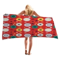 Large red beach towel with vibrant circular mandala geometric patterns shown on a model - Red Round Geometric Art Style (5)