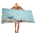 Blue beach towel featuring starfish and seashell ocean prints held by a female model - Sky Blue Marine Sea Star Style (12)