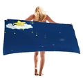 Navy blue beach towel with star and cloud patterns displayed by a model in full width - Hand-drawn Clouds and Stars (8)