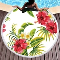 Round thick beach towel with tropical floral prints and white tassel fringe by the pool - Vibrant Red Hibiscus