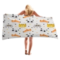 Microfiber beach towel with cartoon animal print held by a model on white background - Cartoon Animal Avatars (5) / 150x75cm