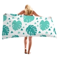 Tropical monstera leaf print beach towel with geometric patterns on model back - 150x75cm / White Cyan Monstera Print (7)