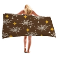 Brown Halloween beach towel with white spider webs and yellow stars held by a model - Brown Spider Web (12)